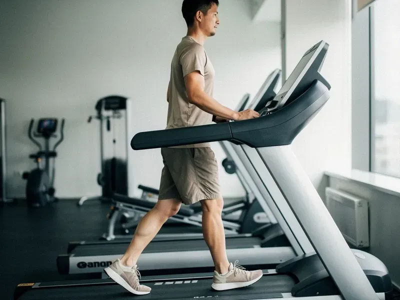 Person incline walking to burn calories