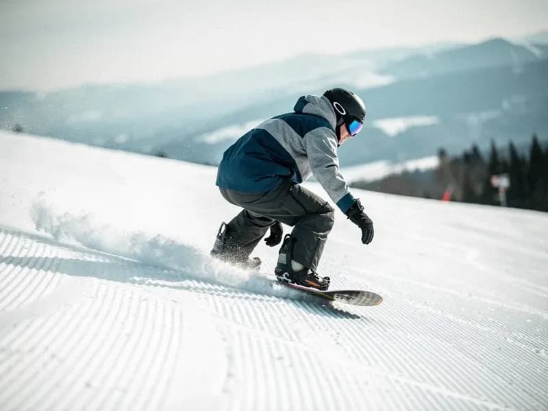 Person snowboarding to burn calories