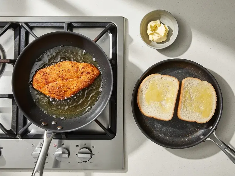 Step 6: While the chicken fries, spread butter on both halves of the bun and toast in a