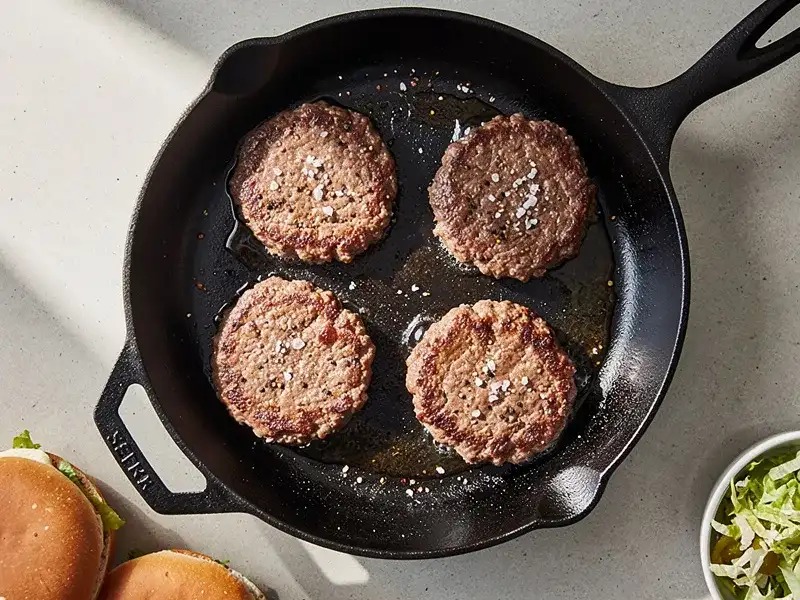 Step 3: Season the beef patties with salt and pepper. Cook them in a hot skillet or on a
