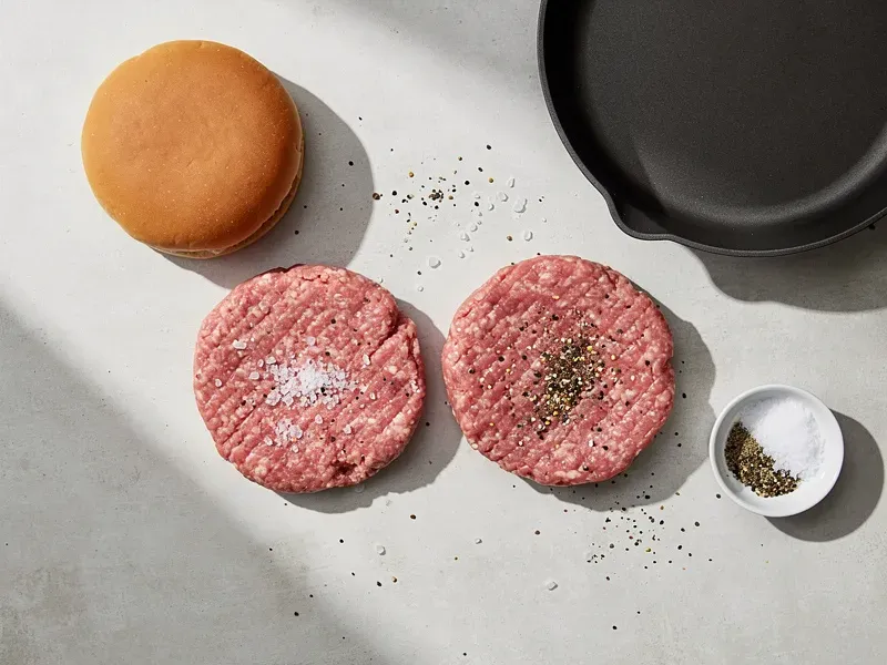 Step 1: Form the ground beef into two thin, flat patties, each slightly wider than the b