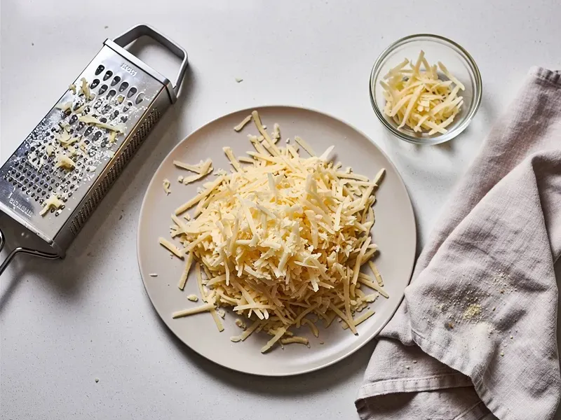 Step 1: Peel and shred the russet potato using a box grater or food processor. Place the