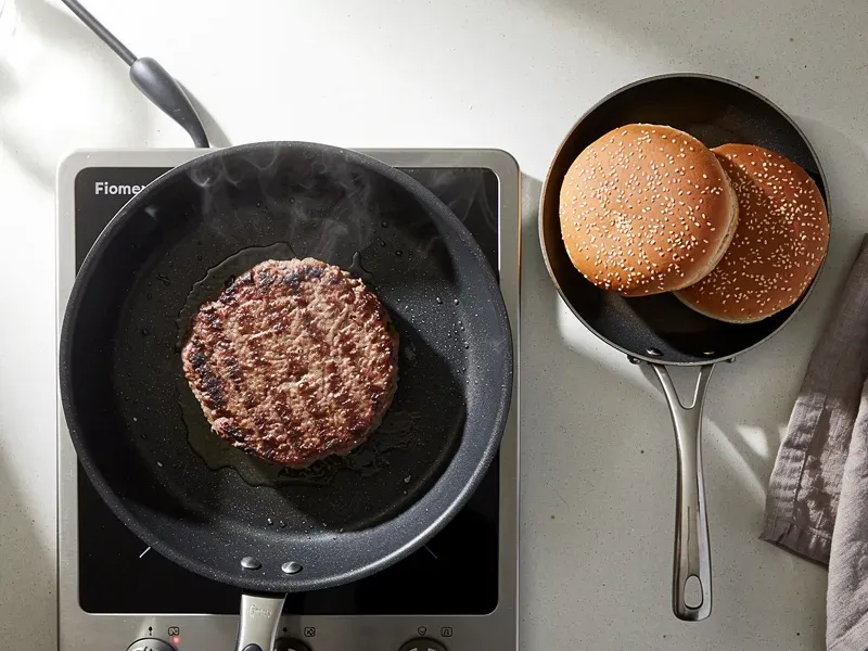 Step 4: While the patty cooks, toast the sesame seed bun halves cut-side down in a separ