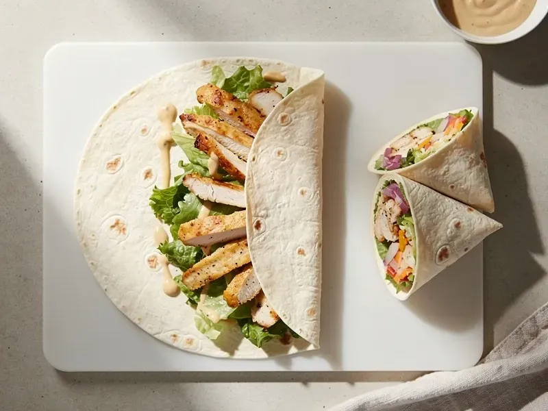 Step 5: Fold the bottom of the tortilla up over the filling, then fold in the left and r