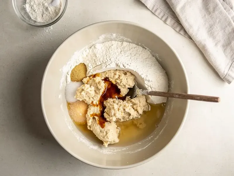Step 1: In a large bowl, combine the bread flour, instant yeast, sugar, and salt. Add th