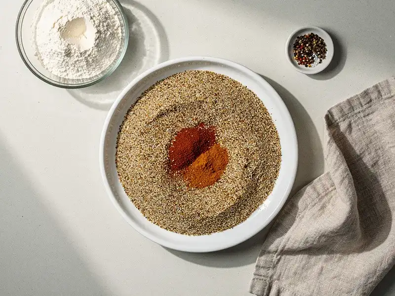 Step 2: In a shallow dish, combine the flour, garlic powder, onion powder, paprika, caye