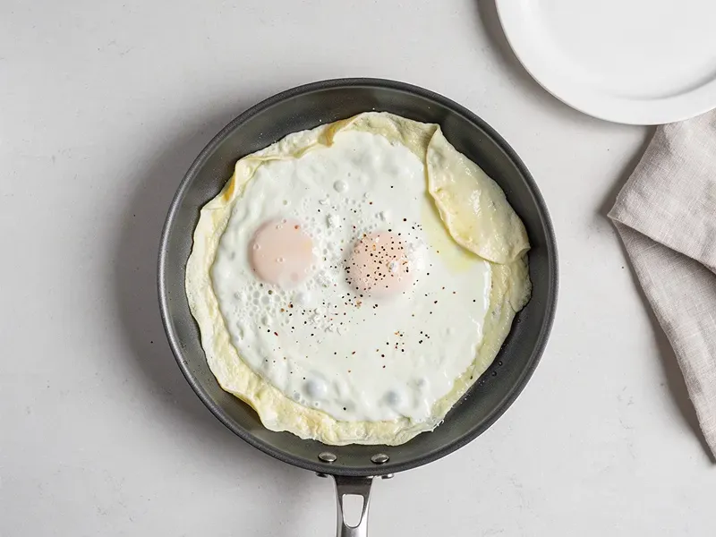 Step 2: Heat a nonstick skillet over medium heat and coat with cooking spray. Pour in th