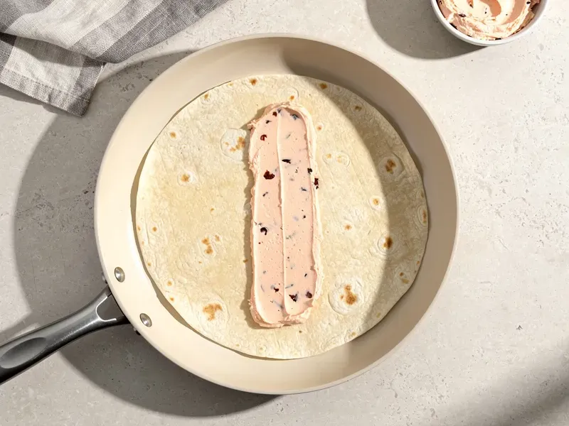 Step 4: Warm the tortilla in a dry skillet or microwave for 10 seconds. Spread the sun-d