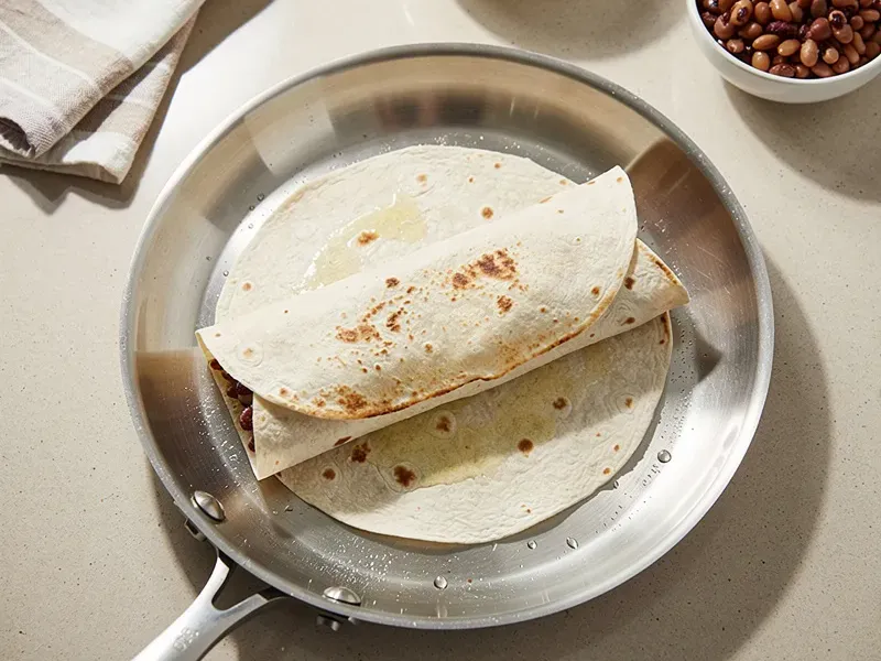 Step 7: Optionally, press the burrito seam-side down on a hot skillet for 30 seconds to