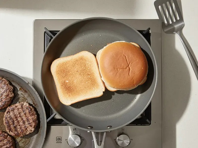 Step 4: While the patties cook, slice the bun in half and toast both halves cut-side dow